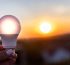 Hand holding a bright LED bulb, useful as an energy-efficient wall light or ceiling fixture.