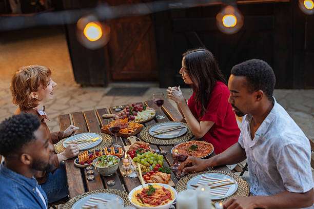 Outdoor solar lights enhance evening garden dining experience.